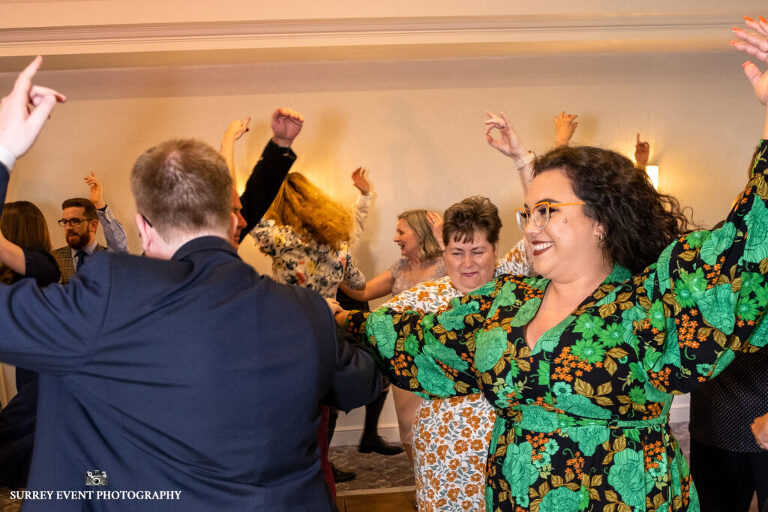 Documentary wedding photography in Surrey at a Scottish ceilidh