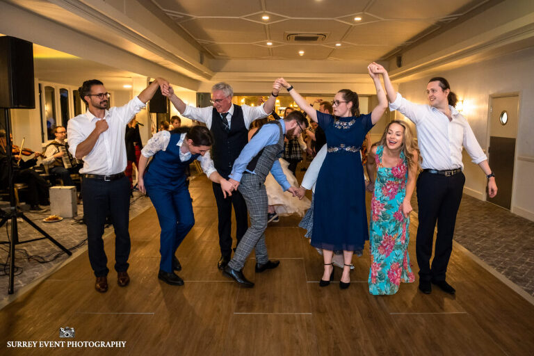 Documentary wedding photography in Surrey at a Scottish ceilidh