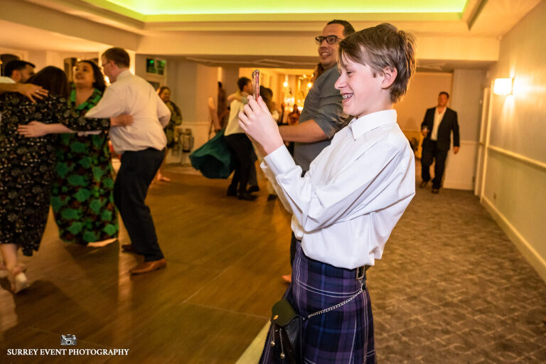 Documentary wedding photography in Surrey at a Scottish ceilidh