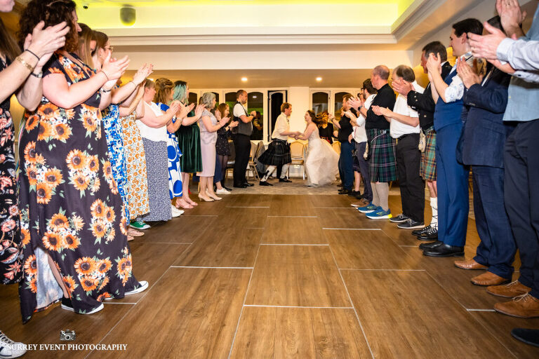 Documentary wedding photography in Surrey at a Scottish ceilidh